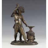A patinated bronze figure, 19th century, modelled as Cupid forging an arrow at an anvil, his bow and