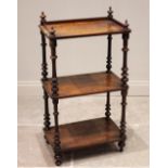 A Victorian figured walnut etagere/what-not, the three quarter galleried upper tier above two