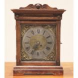 An 18th century and later constructed oak cased mantel timepiece, the 24cm brass and silvered dial