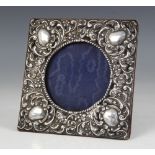 An Edwardian silver mounted photograph frame, W J Myatt & Co, Birmingham 1903, of square form