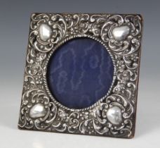 An Edwardian silver mounted photograph frame, W J Myatt & Co, Birmingham 1903, of square form