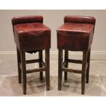 A pair of Art Deco style bar stools, the read leather cubic seats with compact back rests, raised