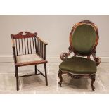 An Edwardian mahogany elbow chair, the twin swan neck rail back upon slender spindles above a padded