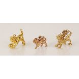 A 9ct gold charm modelled as a dragon, 20mm long (marks worn), together with a 9ct gold charm
