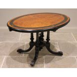A Victorian birds eye maple and ebonised Aesthetic Movement loo table, the quarter veneered oval