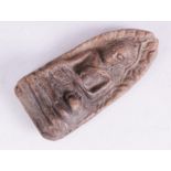 A South East Asian carving of Buddha, depicted seated in bhumisparsa mudra, in the