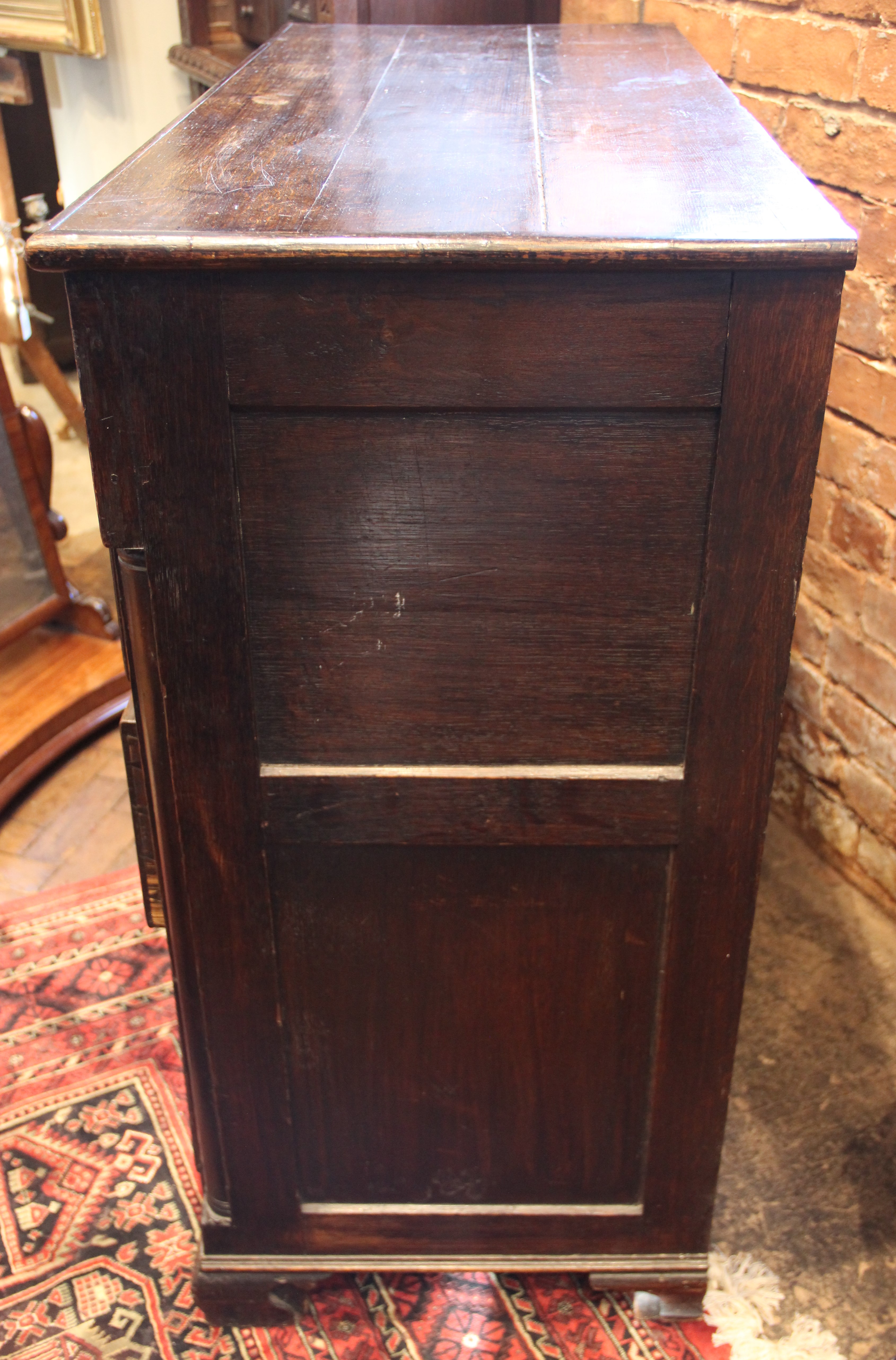 An 18th century oak chest of drawers, the moulded three plank top above two short and three long - Image 6 of 6