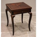 An Edwardian mahogany envelope games table, the folding top inlaid with scrolling foliate detail,