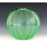 An Art Deco uranium green glass vase, early 20th century, of internally lobed spherical form with