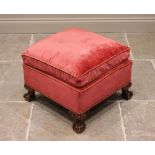 A 19th century style footstool, 20th century, in red velour fabric, with a fixed cushion top, raised