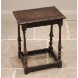A 19th century oak joint stool, the rectangular moulded top raised upon slender ring turned,