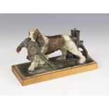 An Austrian cold painted spelter table top lighter, 20th century, modelled as a spaniel retrieving