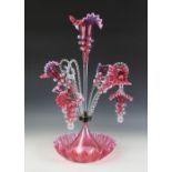 A Victorian pink and white opaque glass epergne, mid 19th century, with three trumpet shaped vases