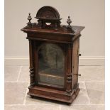 A Victorian mahogany cased 'penny slot' polyphon, the architectural pediment with turned finials and
