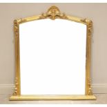 A 19th century style gilt over mantel mirror, later 20th century, the shell moulded crest above an