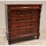 A Victorian mahogany chest of drawers, the rectangular top above a cushion frieze drawer, two