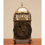 An 18th century style brass lantern clock, early 20th century, the four post case with 18cm dial