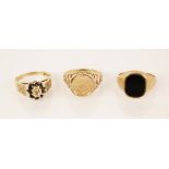 A 9ct gold signet ring, the central black panel measuring 12mm x 10mm, set to a plain polished 9ct