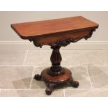 A Victorian mahogany pedestal tea table, the rectangular folding top with rounded front corners