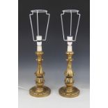 A pair of turned and carved effect table lamps, each with aged gilt effect finish, each 40.5cm