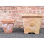 A terracotta planter, of cubic form, moulded in relief with roundel detail, 43cm H x 48cm Sq,