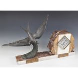 A 1930's French Fexacta Art Deco mantel clock, the plinth surmounted with a bronzed spelter bird