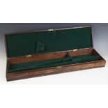 A 19th century rosewood gun case, of plain rectangular form, opening to a fitted baize lined