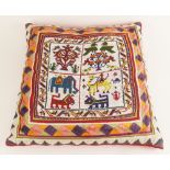 A tribal beaded cushion, mid 20th century, the central beaded panel depicting monkeys, parrots,