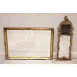 A gilt composite rococo style mirror, late 20th century, the shaped mirrored plate within a relief