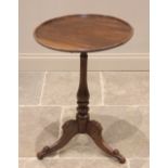 A 19th century mahogany tray top tripod table, the circular top with a moulded rim raised upon a