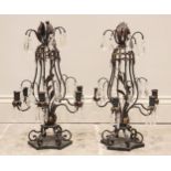 A pair of oxidised copper girandoles, early 20th century, the baluster frame extending to 'S' shaped