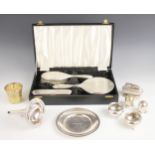 A cased silver mounted dressing table set, Adie Brothers, Birmingham 1962, comprising mirror,