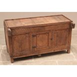 An Indian carved hardwood dowry chest, late 19th/early 20th century, the galleried plank top above a