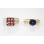 A synthetic sapphire and diamond 9ct gold ring, the central oval synthetic sapphire measuring 10mm x