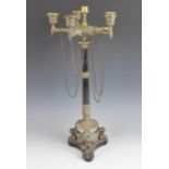 A 19th century polished slate and gilt metal French Empire style candelabra, the five cast