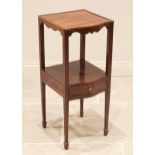 A George III serpentine mahogany nightstand, the moulded top with a chevron banded edge, above a