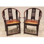 A pair of Chinese stained elm altar chairs, 20th century, each with a horseshoe top rail and