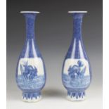 A pair of Chinese porcelain blue and white bottle vases, 19th century, each of slender
