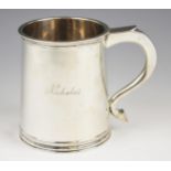 A George IV silver tankard, Adie Brothers, Birmingham 1948, of tapering cylindrical form of raised