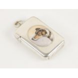 A Victorian silver and enamel vesta case, of rounded rectangular form with hinged cover, with an