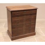 An early 20th oak map chest, the rectangular moulded top above fifteen drawers applied with