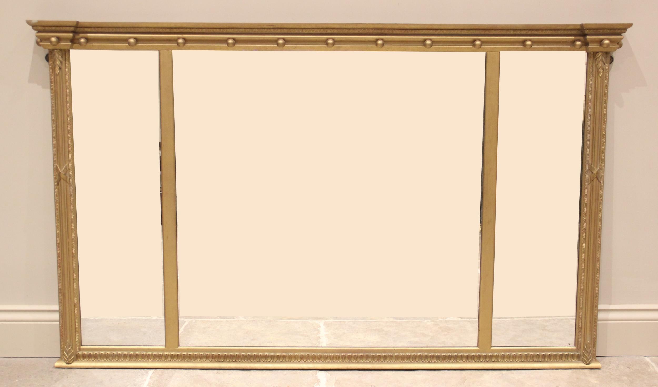 A Regency style gilt wood and gesso triptych over mantel wall mirror, 20th century, the moulded