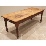 A Victorian style pine kitchen table, late 20th century, the rectangular plank top with rounded