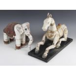 Two Burmese carved wood and painted marionette puppets, modelled as an elephant, with attached