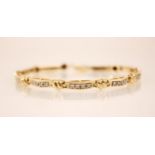 A diamond set 18ct gold line bracelet, each lozenge shaped link set with four round brilliant cut