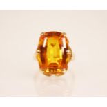 A synthetic sapphire dress ring, the central rectangular cushion shaped mixed cut citrine measuring