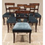 A matched set of six Regency mahogany dining chairs, each with a rail back over a stuff-over seat,