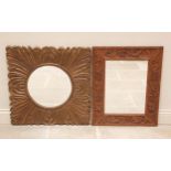 A carved oak wall mirror, 20th century, the rectangular frame carved with grapes and vinery