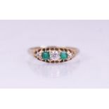 A Victorian emerald and diamond five-stone ring, comprising a central round mixed cut diamond