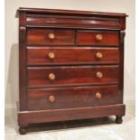 A Victorian mahogany chest of drawers, formed from a cushion frieze drawer over two short and
